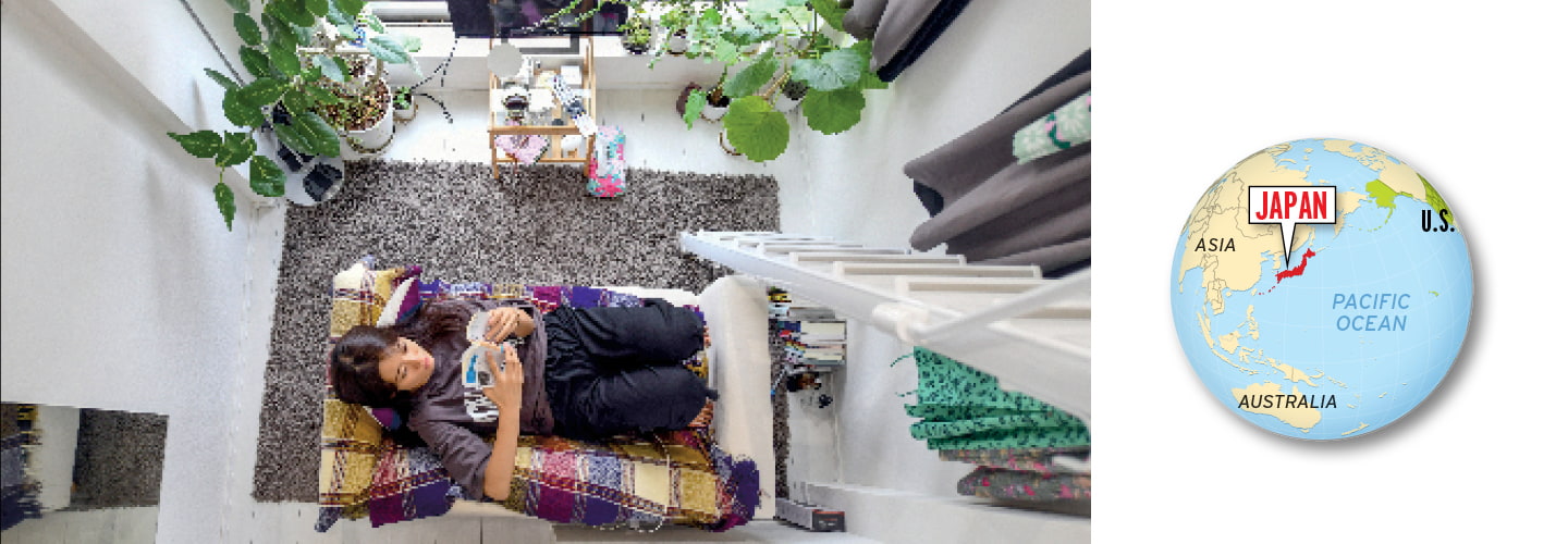 Overhead view of a person laying on a chair in a room and an image of a world map highlighting Japan